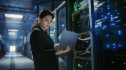 IT engineer checks data centre