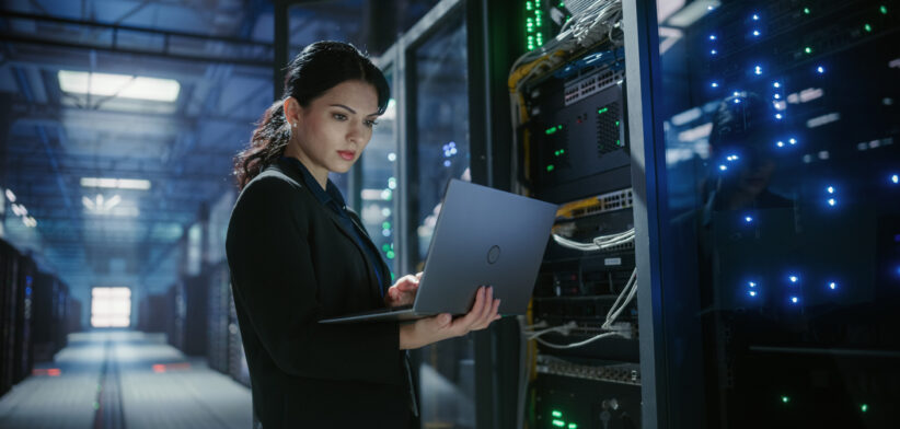 IT engineer checks data centre