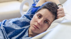 Woman lying in a hospital bed