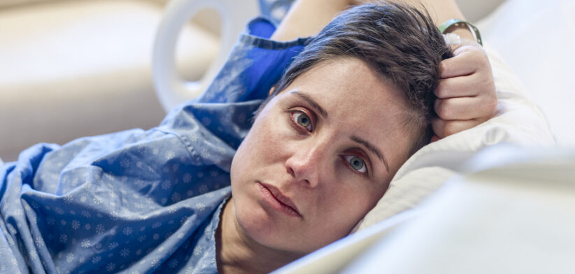 Woman lying in a hospital bed