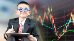 Little bussiness boy with tablet