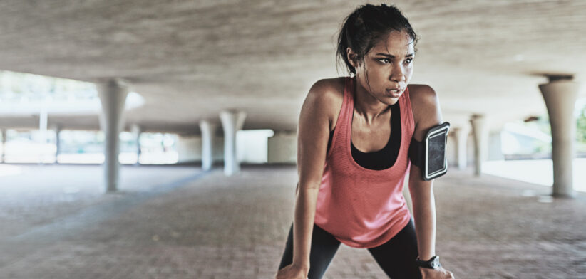 Woman stopping to catch her breath while exercising