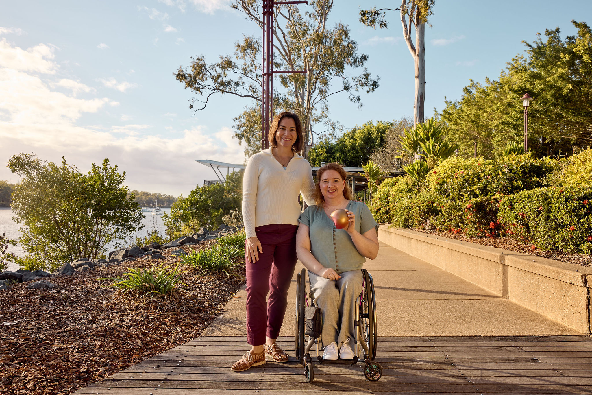 Anna Meares and Angela Ballard with a piece of the Brisbane 2032 Emblems at Riverside Park in ROckhampton. Supplied by Brisbane 2032 (1)