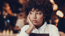 Tired young lady looking aside