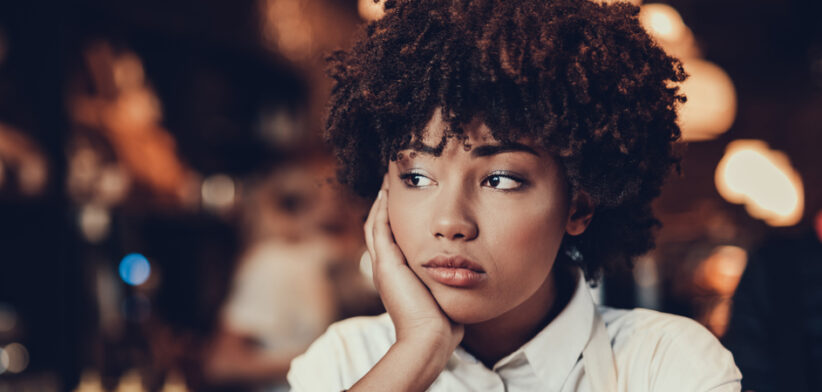 Tired young lady looking aside