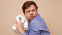 Man with toilet paper