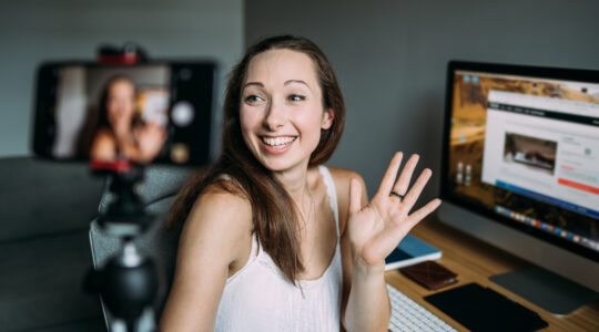 Woman vlogging at home