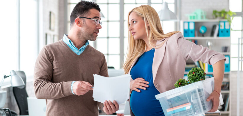 Pregnant woman being fired from job by employer