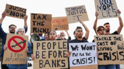 Crowd of people protest against inflation