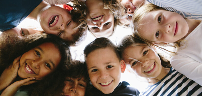 laughing group of kids in circle